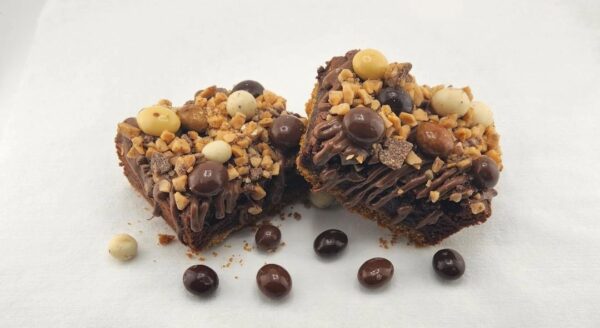 A close up of two pieces of chocolate cake