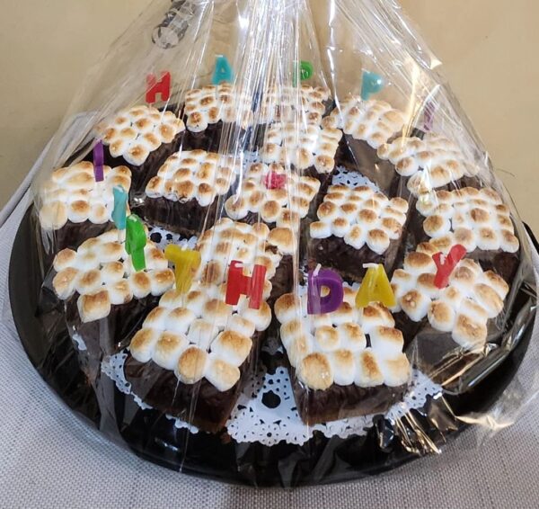 A bunch of brownies with marshmallows on them