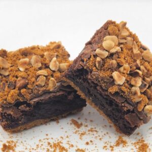 Two chocolate brownies with hazelnut crumble.