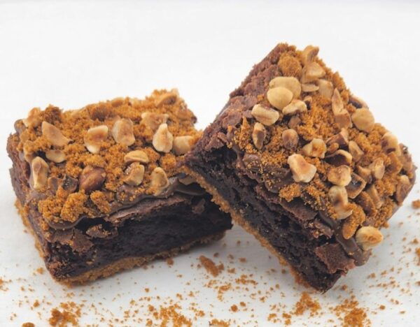 Two chocolate brownies with hazelnut crumble.